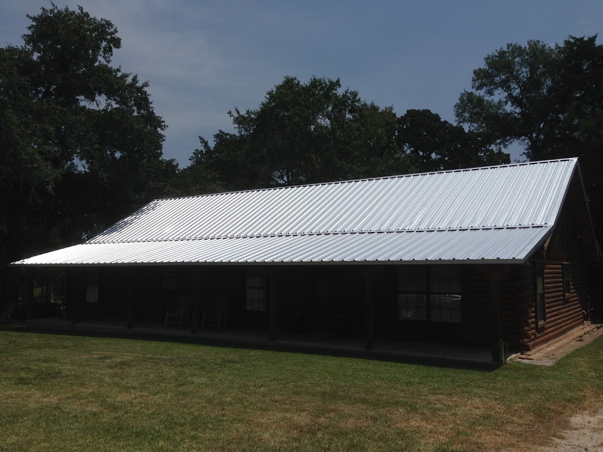 Corrugated metal roof on a log cabin building