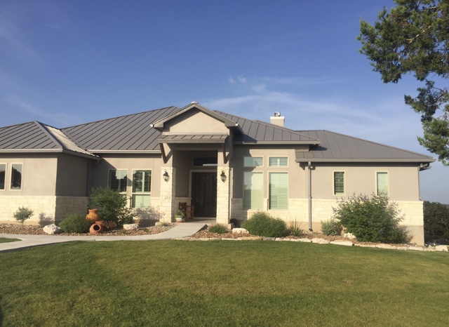 Standing-seam metal roof on an elegant Hill Country home