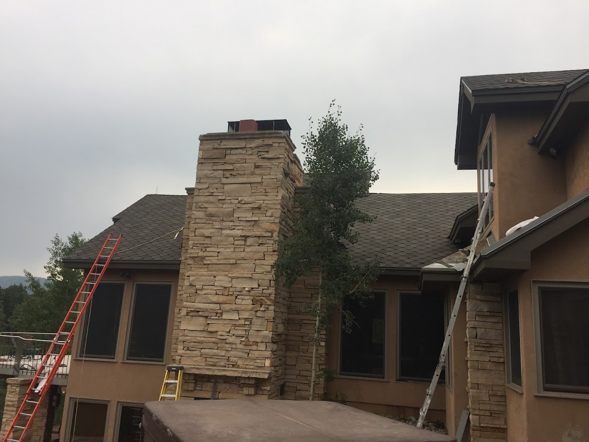 Completed roof near stone chimney